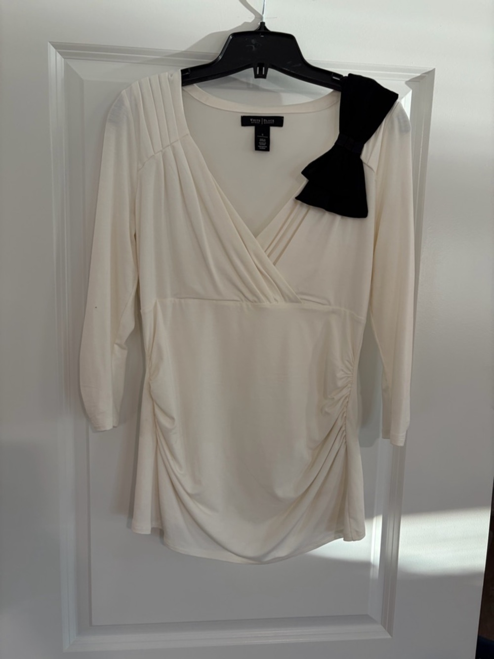 White House Black Market Cream Wrap-Front Tunic with Black Shoulder Bow